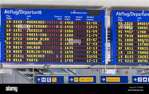 Airport flight information displayed on departure board, flight status ...