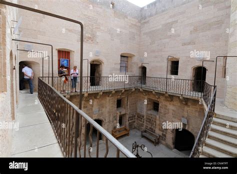 Visitors wondering around the prison at the Chateau d'If near Marseille ...