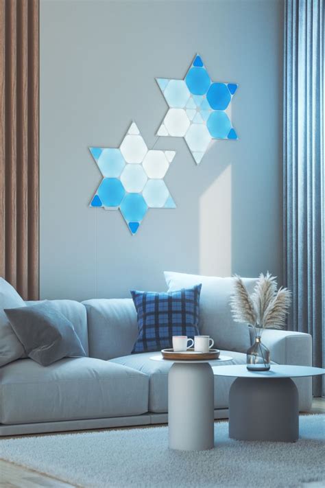 Nanoleaf Shapes mounted on the wall in a living room behind the couch ...