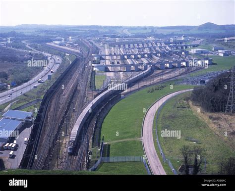 Eurotunnel shuttle train leaving the Channel Tunnel rail terminal near ...