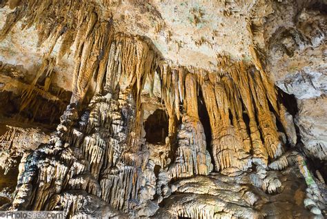 Stalactites drip onto stalagmites, forming columns where they meet ...