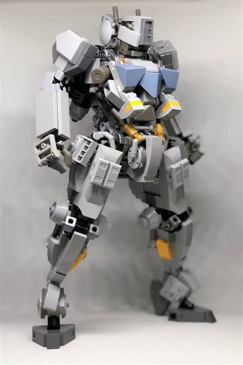 a lego robot that is standing on one leg