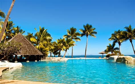 Water ocean Sun summer tropical Fiji palm trees huts swimming pools ...