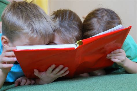 Children Reading A Book - Business In The Community