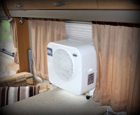 Portable air conditioning unit shown inside Swift Challenger caravan ...