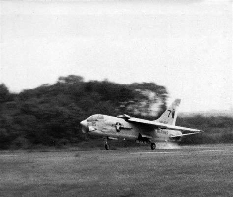 Series of photos of F-8 Crusader landing with only one main gear down ...