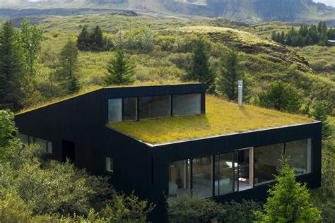 The green roof of this holiday home was designed to blend in seamlessly ...