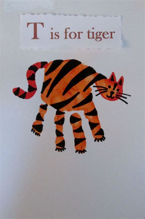 Tiger handprint | Hand print animals, Alphabet book, Tiger crafts