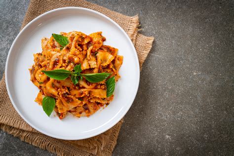 Farfalle pasta with basil and garlic in tomato sauce - Italian sauce ...