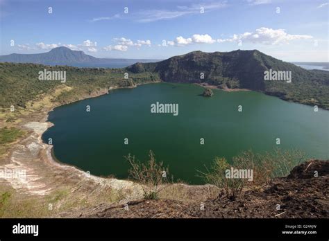 Crater lake in the main crater of Taal Volcano, with Lake Taal in the ...