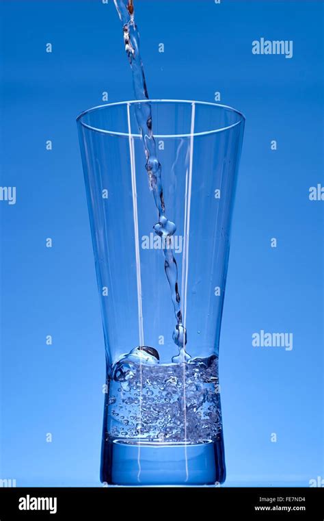 A studio photo of a tall water glass Stock Photo - Alamy