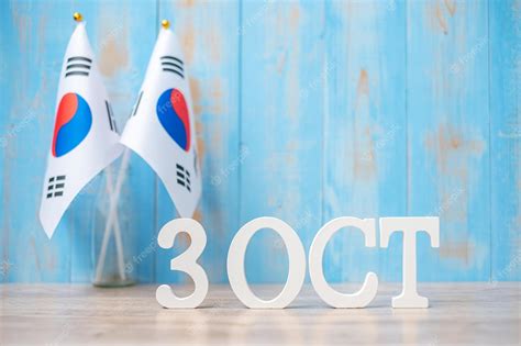 Premium Photo | Wooden text of october 3rd with republic of korea flags ...