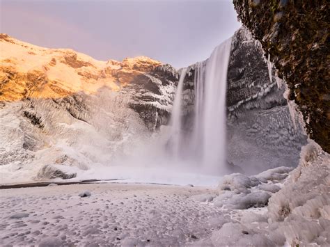 Beautiful Skogafoss waterfall in winter. Iceland. - UNLOCK ICELAND