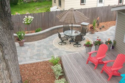 Permeable paver patio pairs perfectly with deck | Villa Landscapes