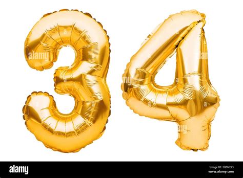 Number 34 thirty four made of golden inflatable balloons isolated on ...