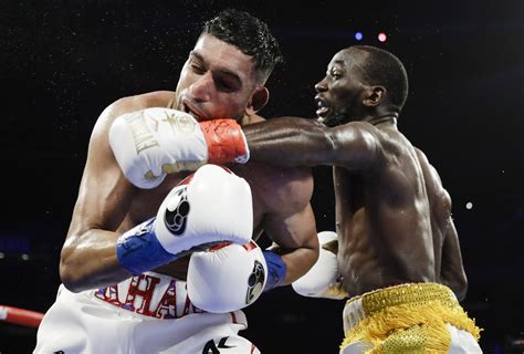 Crawford wins by TKO when Khan doesn't go on after low blow | AP News