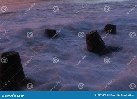 Wave breaker sunset slow stock image. Image of breakwaters - 134590695