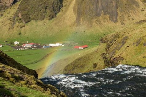 Premium Photo | Rainbow over the skogafoss waterfall in iceland