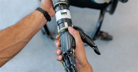 Person Holding Prosthetic Arm · Free Stock Photo