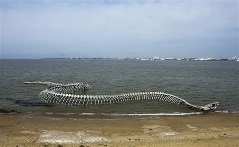 Serpent d'Océan, A Massive Metal Sea Serpent Skeleton Installed on a ...