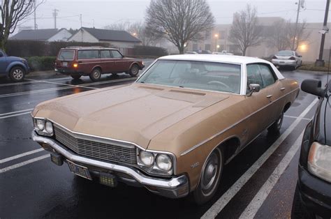 OLD PARKED CARS.: 1970 Chevrolet Impala 4-door hardtop.