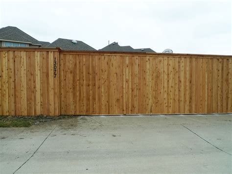 8 foot unstained Cedar board on board fence with Electric Gate ...