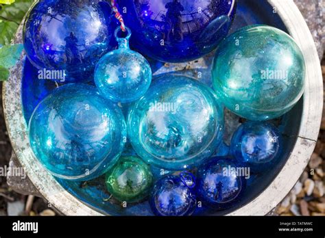 Glass balls in a garden Stock Photo - Alamy