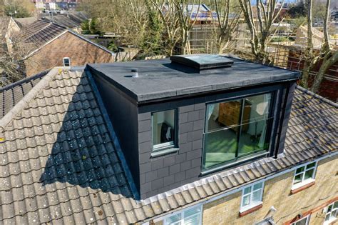 Dormer exterior view with grey slates SE London