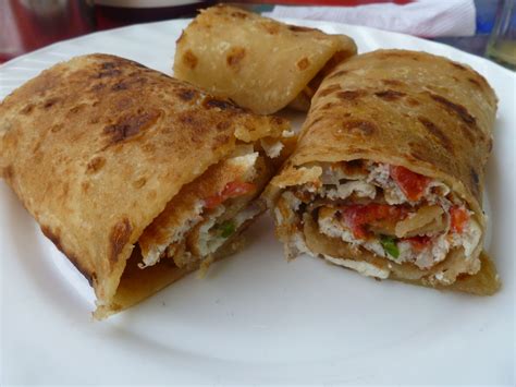 Ugandan street food- called a Rolex It's a omelette wrapped in chapatti ...