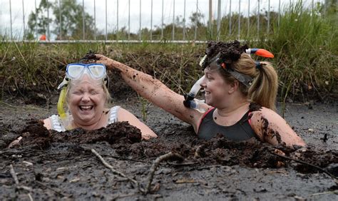 Irish Bog Snorkeling Championships - Two female entrants take a dip in ...