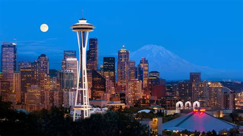 Downtown Seattle skyline and Space Needle at night with full moon ...