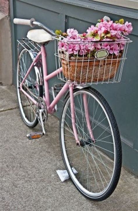 This vintage pink girls bicycle has beautiful pink flowers in.. | Pink ...