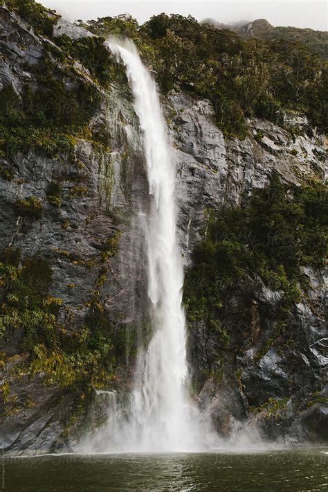 "Milford Sound Waterfall" by Stocksy Contributor "Cameron Zegers" - Stocksy