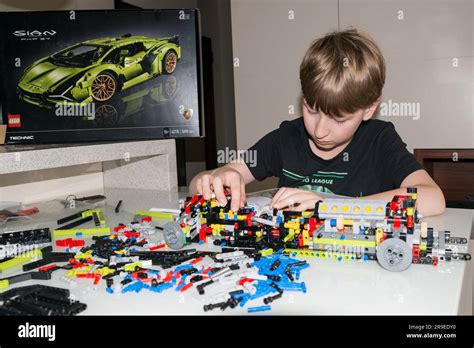 9 year old boy playing with Lego set Stock Photo - Alamy