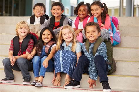 Group Of Elementary School Kids In The School Yard Stock