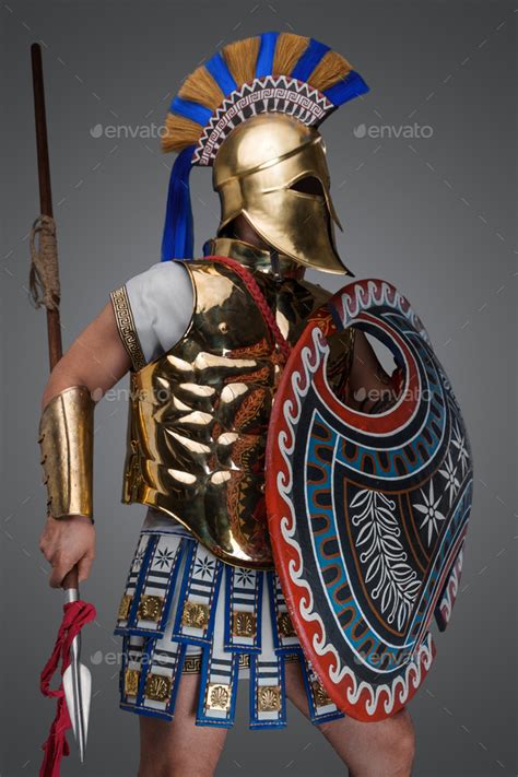 Ancient greek warrior with bronze plate armor and helmet Stock Photo by ...