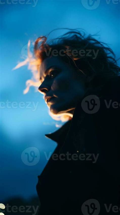 a woman in a black jacket with her hair blowing in the wind generative ...