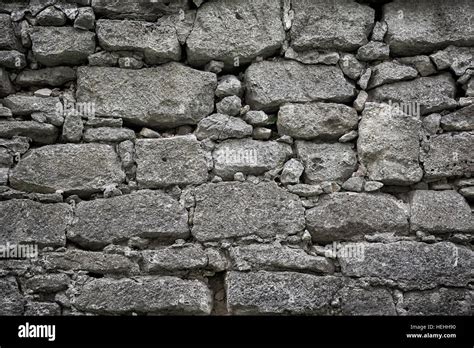 Old stone bricks wall texture background. Vintage dark toned Stock ...