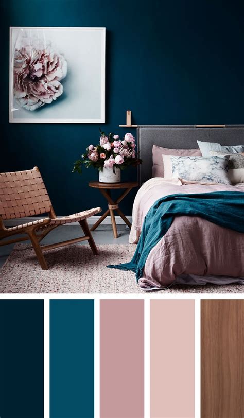 a bedroom with blue and pink colors in the walls, bedding and decor on ...