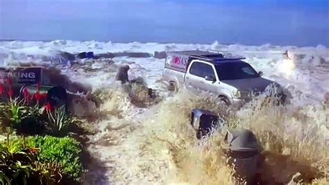 Dramatic video shows rogue wave slamming into California street ...