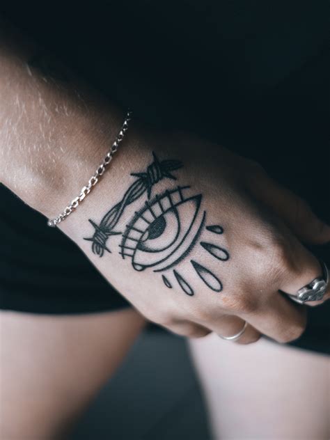 Discover the Dark History and Meaning of Evil Eye Tattoos — Certified ...