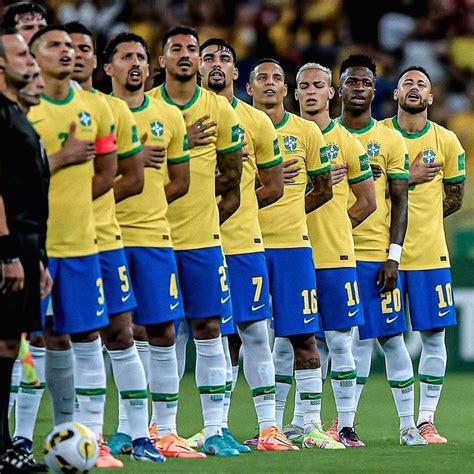 a group of men standing next to each other on a soccer field