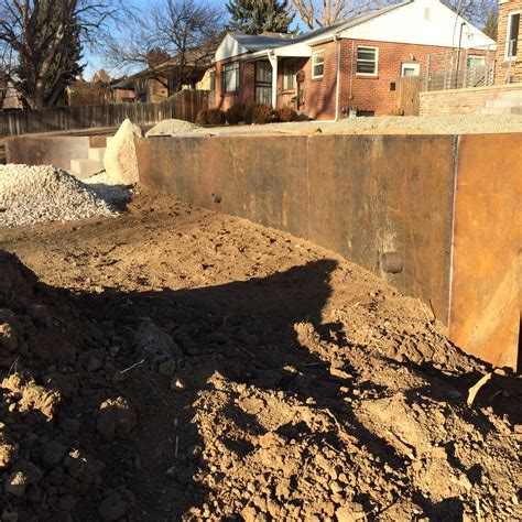 Corten steel retaining wall almost set. Installed by Industrial Luxury ...