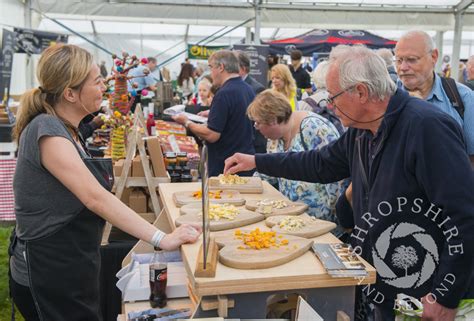 Visitors sample a selection of cheeses at Ludlow Food Festival, Shropshire.