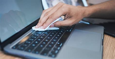 Premium Photo | Cleaning wipe dust and hands with laptop for hygiene ...