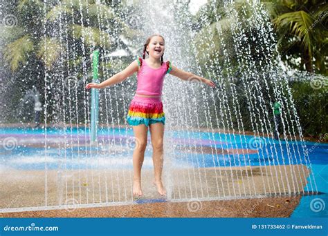 Kids Play in Aqua Park. Children at Water Playground of Tropical ...