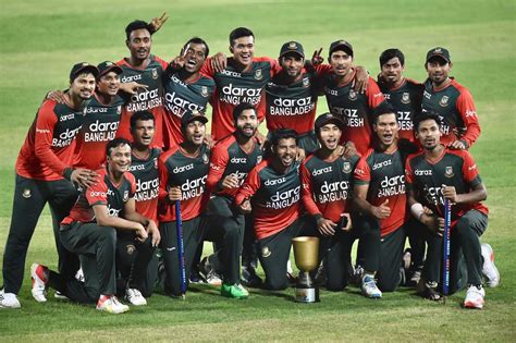 The Bangladesh team pose happily with their trophy | ESPNcricinfo.com