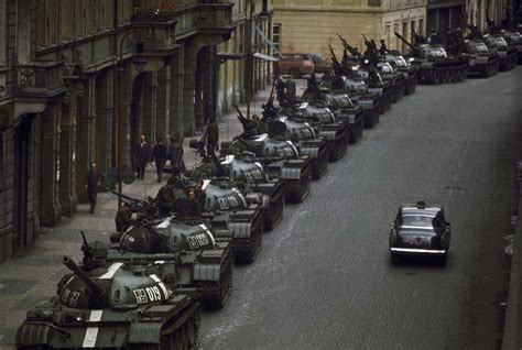 Prague Spring: A lone car passes Soviet tanks during the Soviet ...