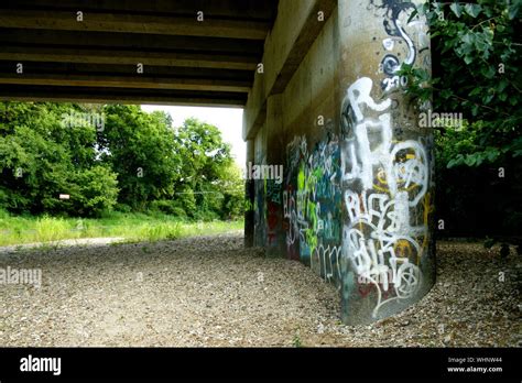 Graffiti under a bridge Stock Photo - Alamy