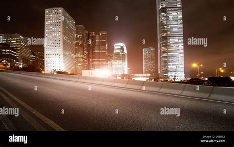 Highway and city at night Stock Photo - Alamy